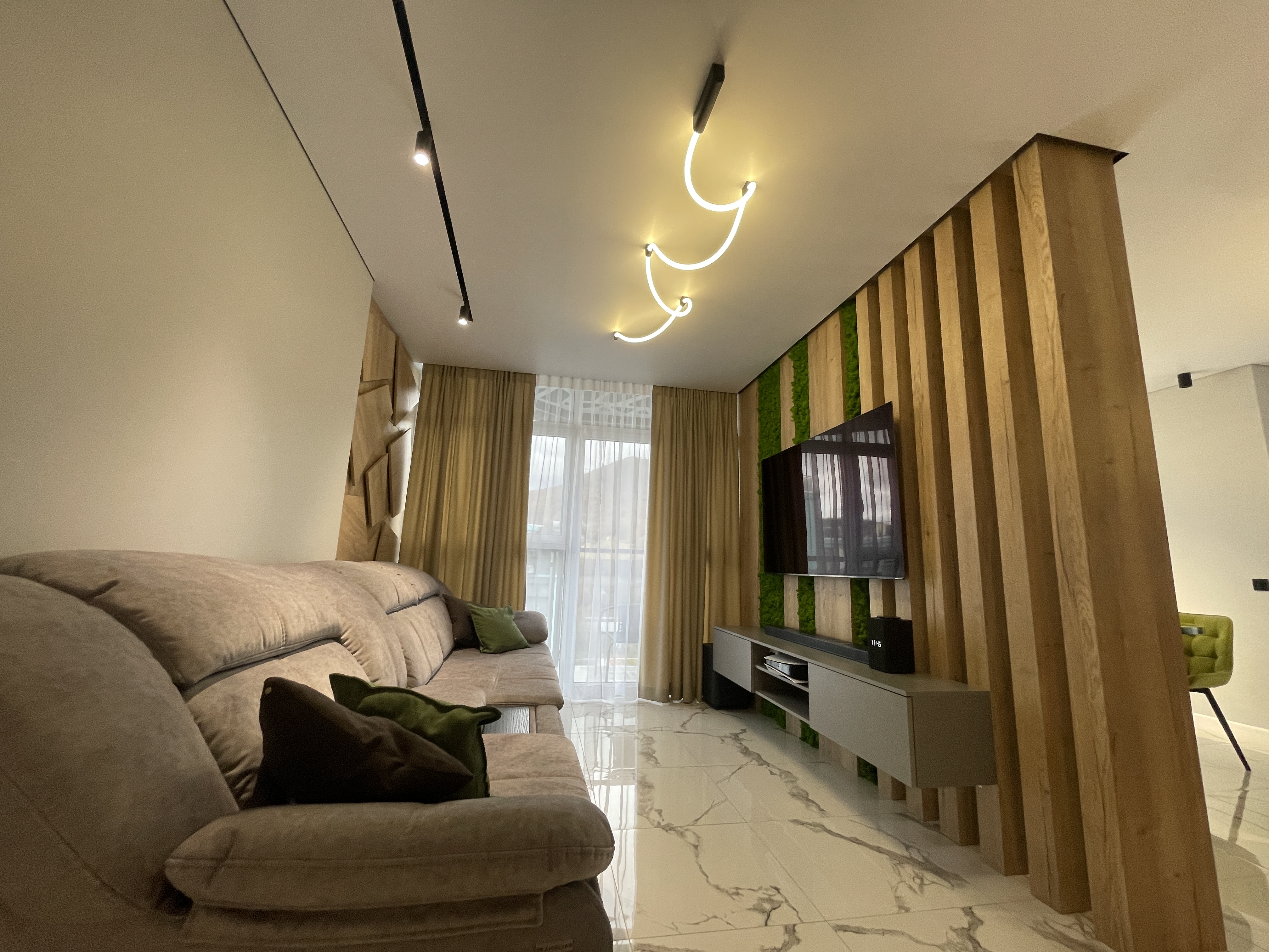 Modern apartment living area with integrated lighting design in Russia